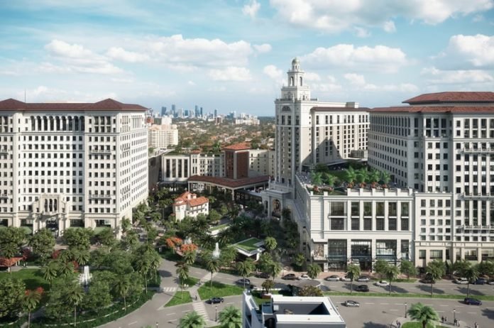 Aerial rendering of The Plaza Coral Gables with the downtown Miami skyline in the distance