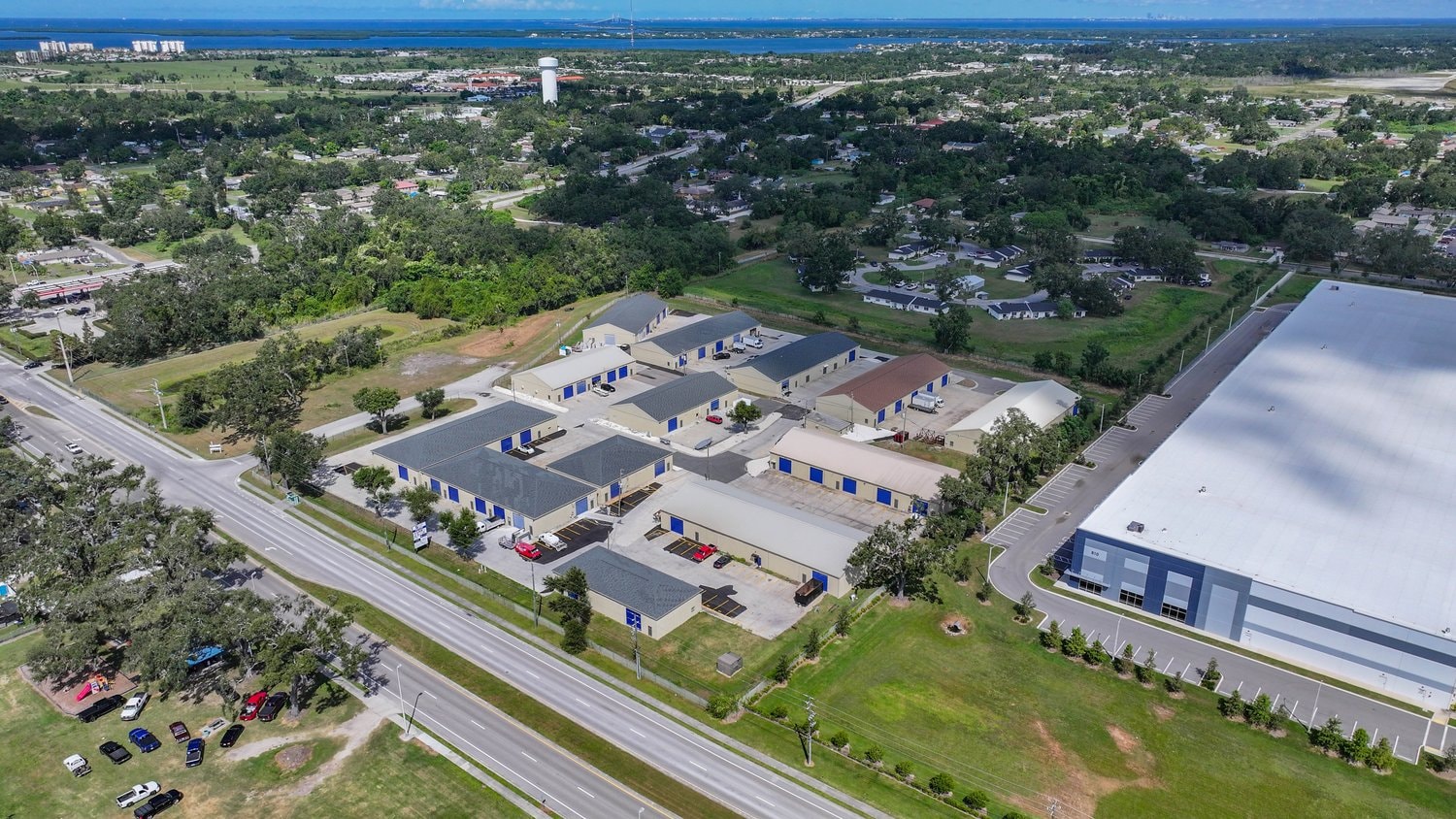 Aerial view of the Palmetto small-bay industrial campus with Tampa Bay in the background