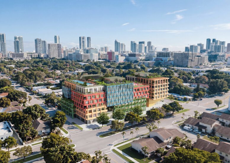 Aerial rendering of WOMA Wynwood with the downtown Miami skyline beyond