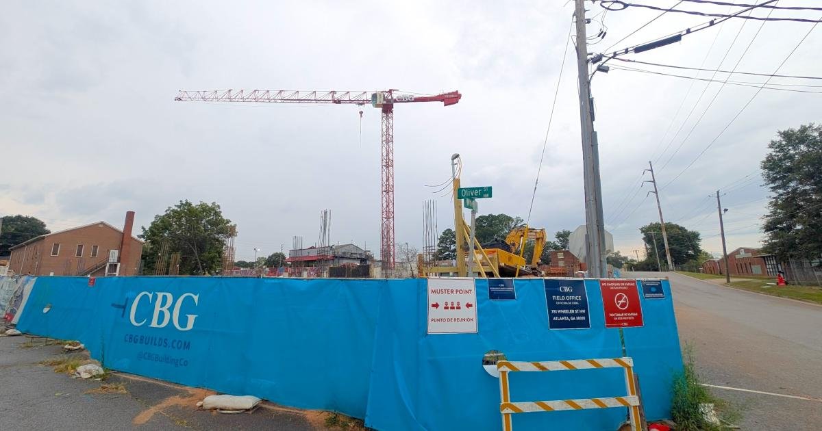 Tower crane rises at The Proctor construction site near Oliver Street in English Avenue