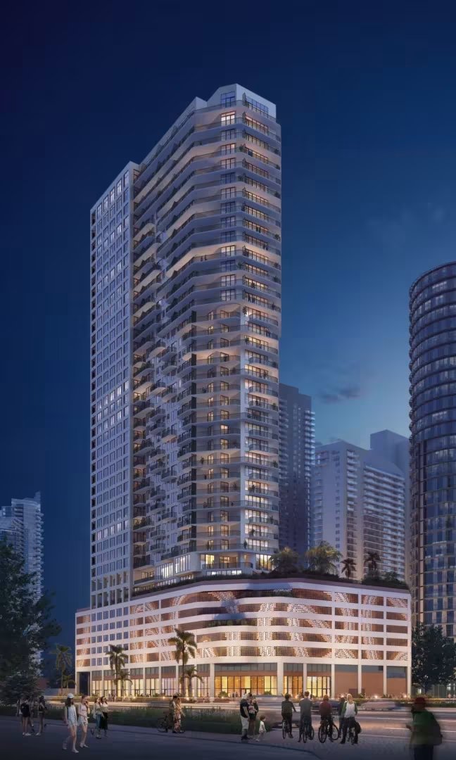 Evening rendering of 1775 Biscayne with its illuminated podium (ODP Architects)