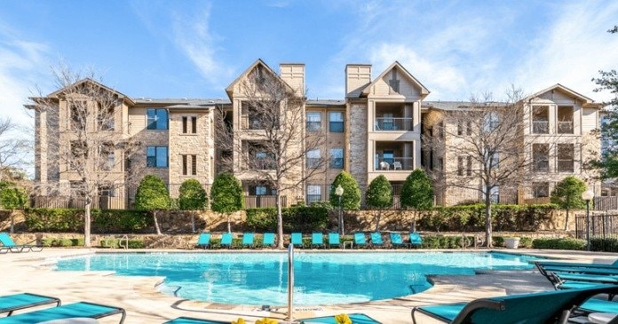 Pool and residential buildings at Sol Riverside (formerly Lakeside Villas) in Grand Prairie