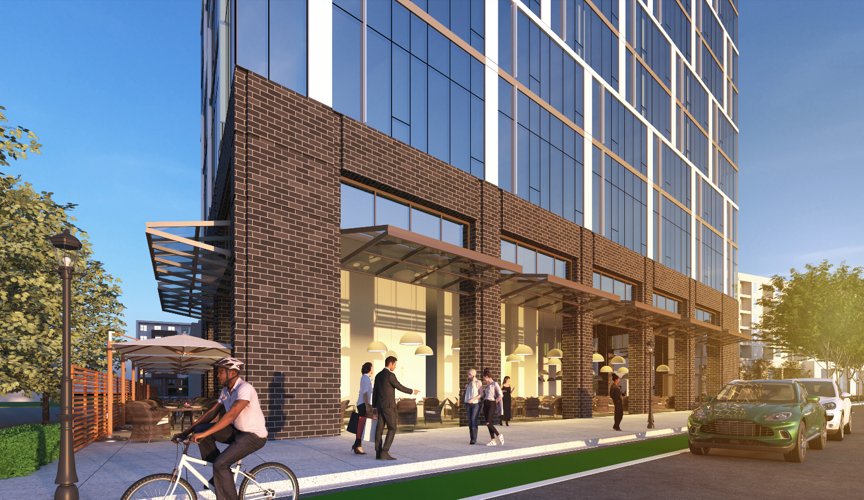 Street-level view of 22 Elliston's brick podium and ground-floor retail