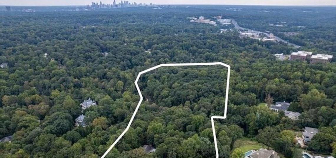 Aerial view of the roughly 30-acre Bunnen property (outlined) in Buckhead, with the Atlanta skyline in the distance