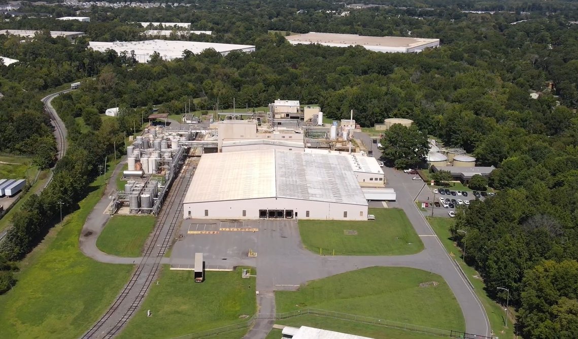 Aerial view of the existing warehouse and process structures at 8309 Wilkinson Blvd