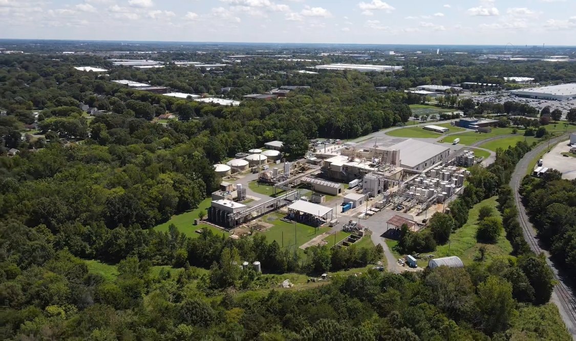 Aerial view of the existing industrial facility at 8309 Wilkinson Blvd prior to redevelopment
