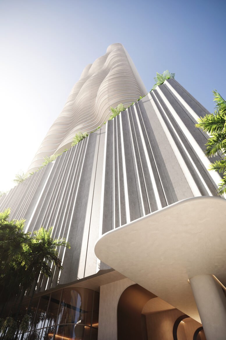 View looking up at the tower's sculpted facade and podium