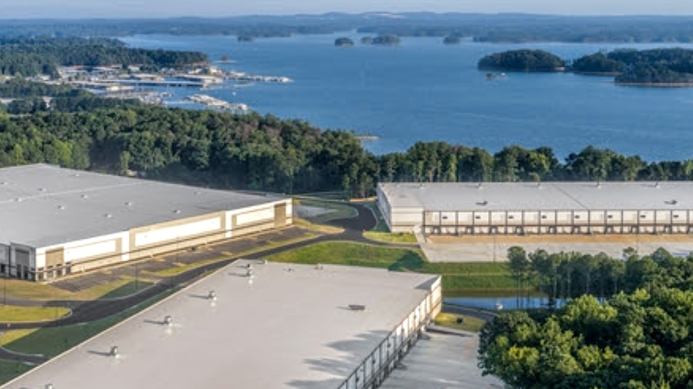 The three warehouse buildings of Buford Creek Business Center with Lake Lanier beyond