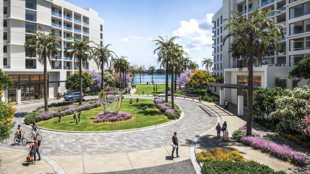 Rendering of the central plaza and sculpture garden at Water Club St. Pete Beach, with views toward the water