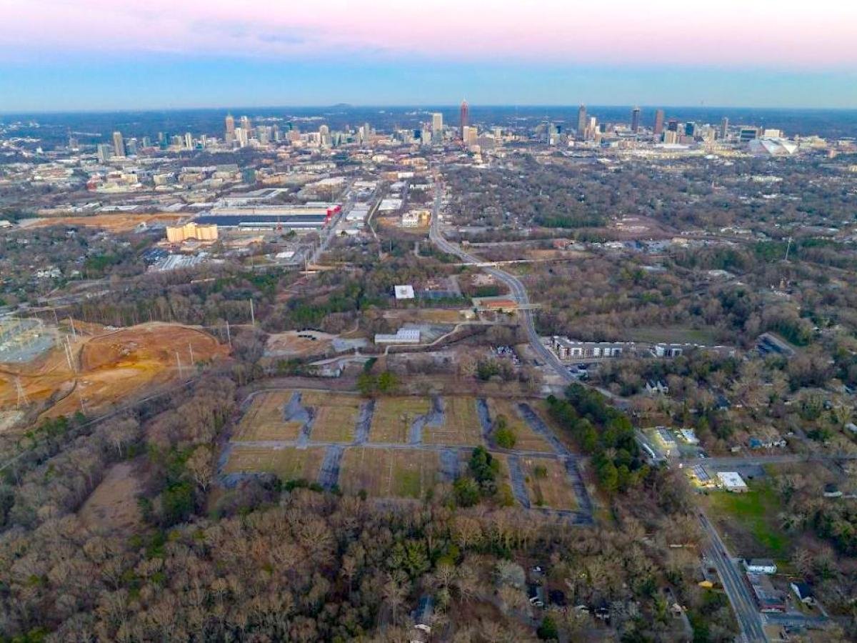 Aerial view of Atlanta's Westside near Grove Park, with the downtown skyline beyond