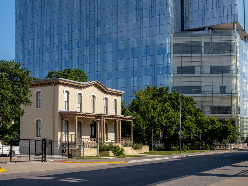 The Castleman-Bull House at 201 Red River St sits amid downtown Austin high-rises near the convention center