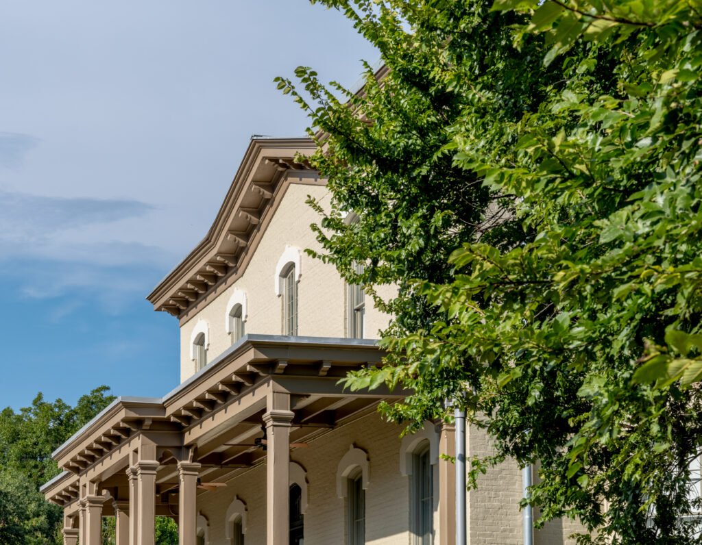 Porch and eave detail of the historic Castleman-Bull House at 201 Red River St