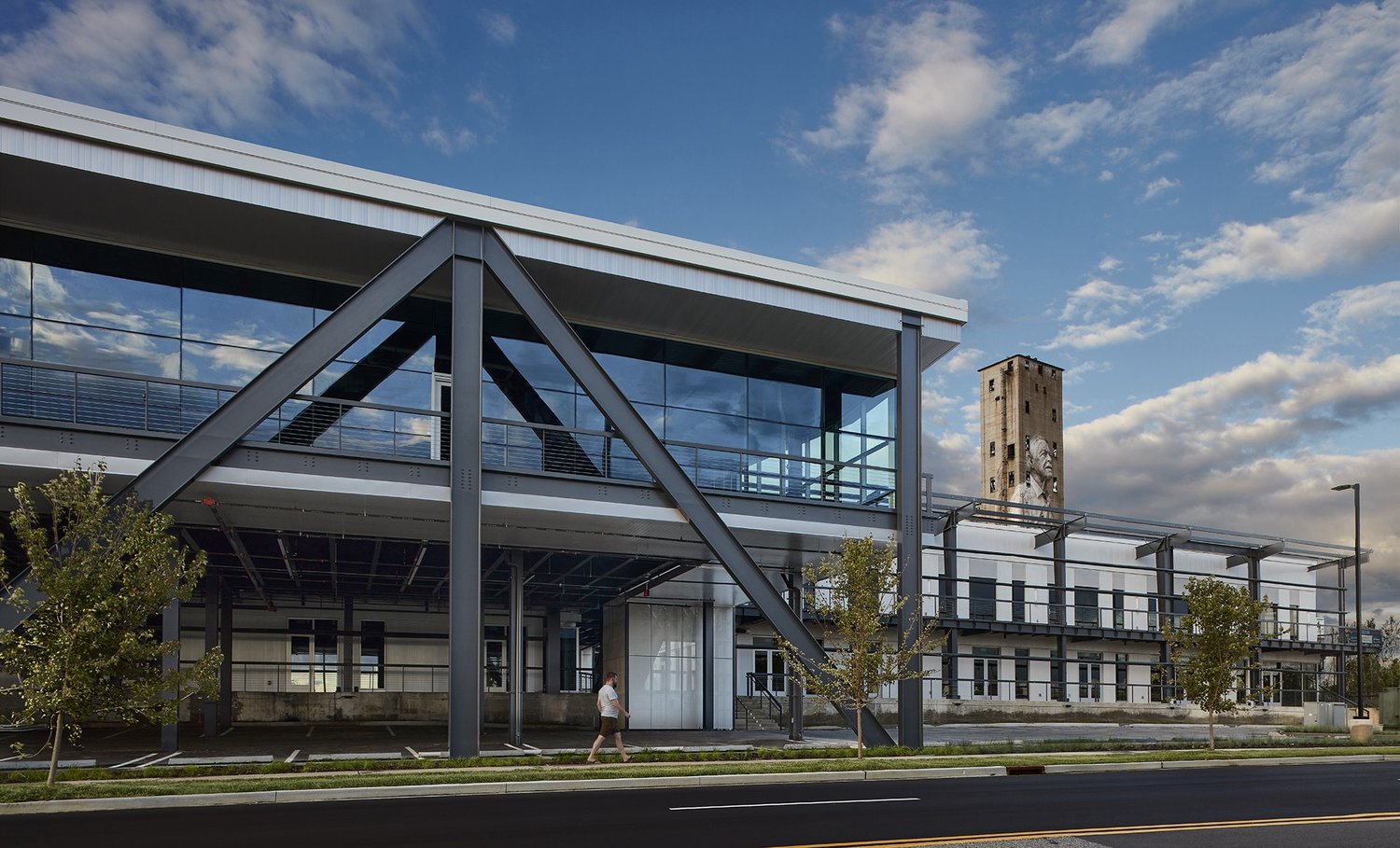 Stateline's completed steel-and-glass structure with the historic silo mural beyond