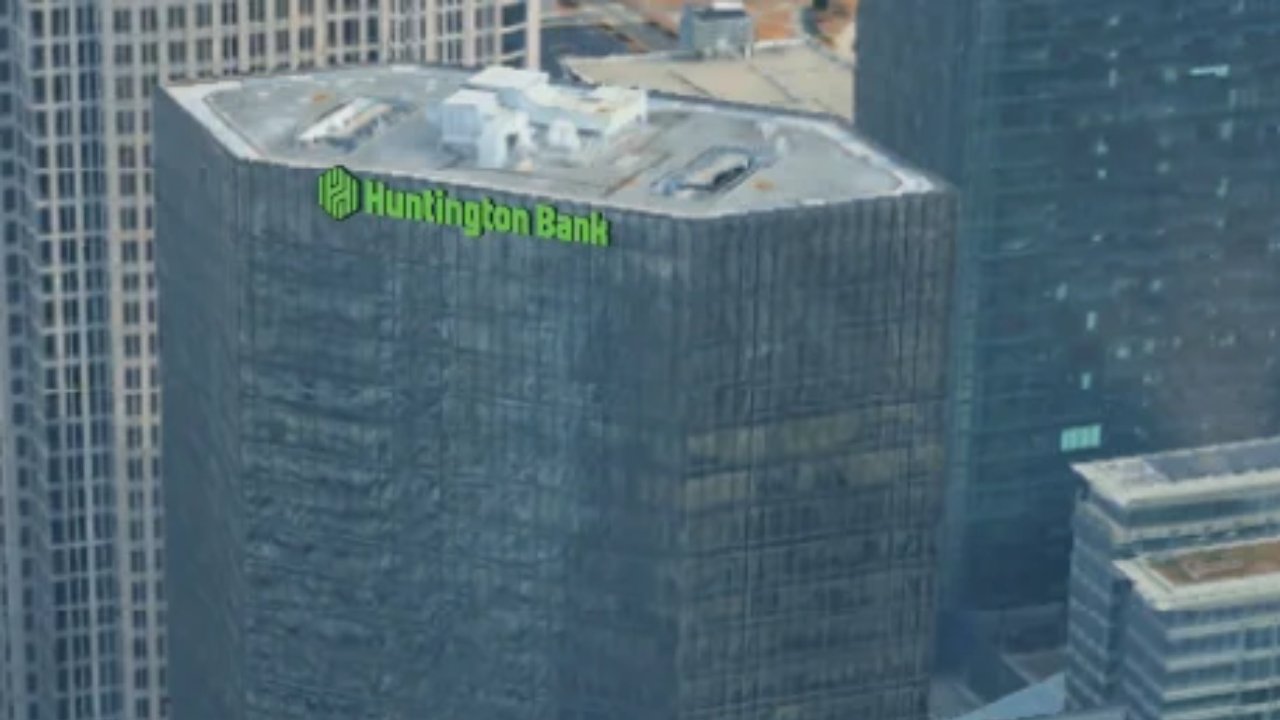 Close-up of the Huntington Bank sign atop One South at 101 S. Tryon St.