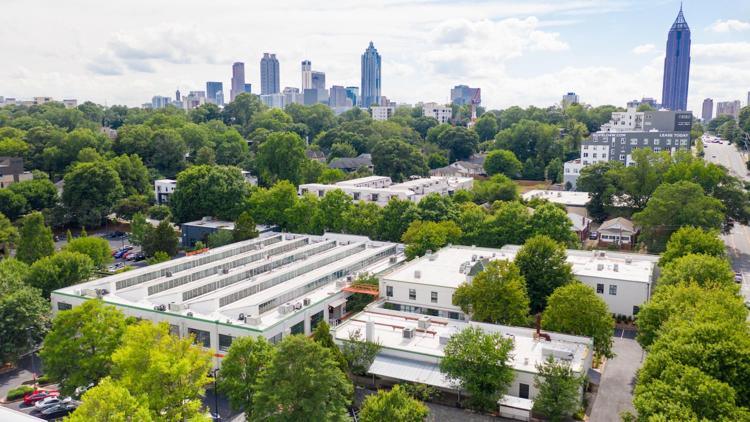 Aerial view of the Southern Dairies campus with the Midtown skyline beyond