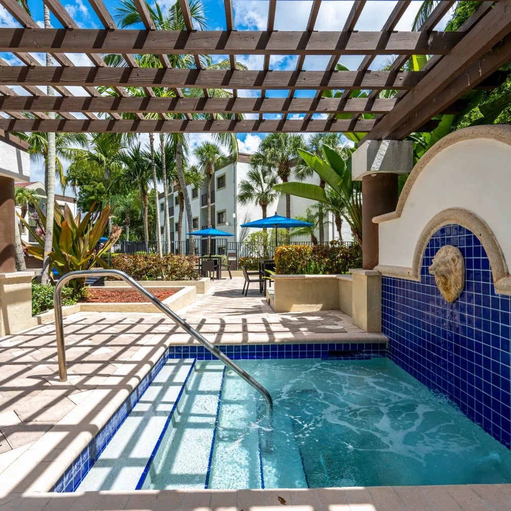 Spa and pergola area at Emerald Palms Apartments