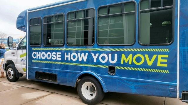 A WeGo transit vehicle wrapped in Choose How You Move branding in Nashville