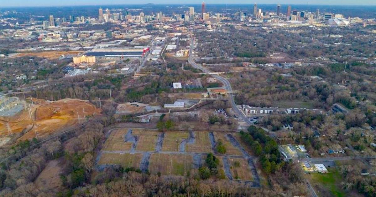 Aerial view of the Grove Park land donated by Microsoft, with the downtown Atlanta skyline beyond