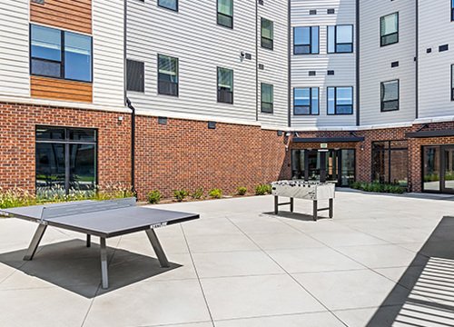 Resident courtyard with game tables at Legacy at Herndon Square