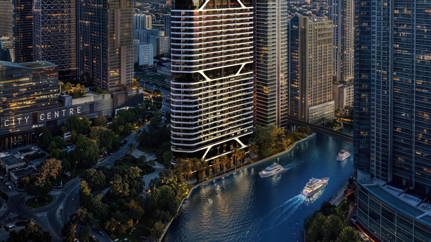 Night rendering of Bugatti Residences Miami rising above the Miami River